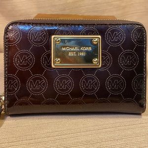 Michael Kors zip-around perforated MK logo wallet